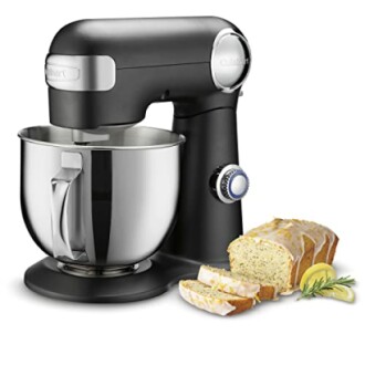 Black stand mixer with a stainless steel bowl and sliced bread.