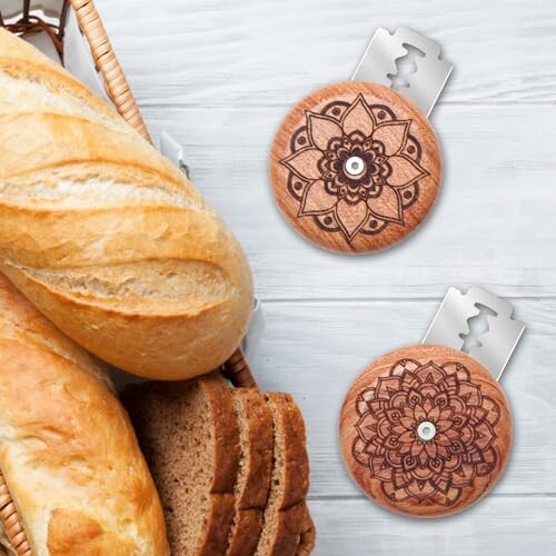 Wooden round bread slicer with mandala design next to sliced bread.