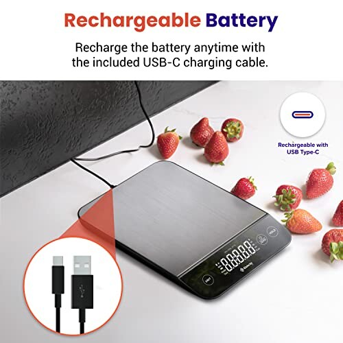 Digital kitchen scale with rechargeable battery and USB-C cable, strawberries on the side.
