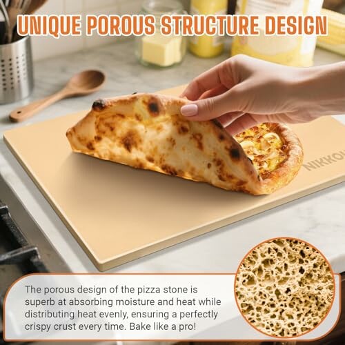 Hand lifting pizza slice on porous pizza stone.