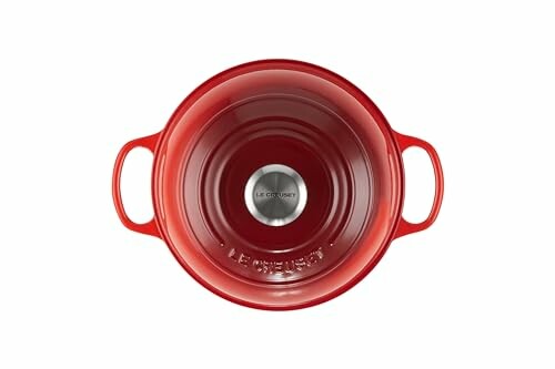 Top view of a red cast iron casserole with handles.