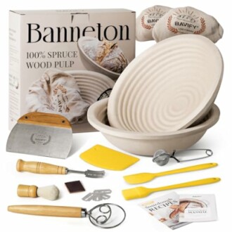 A sourdough bread baking kit with tools and banneton basket.