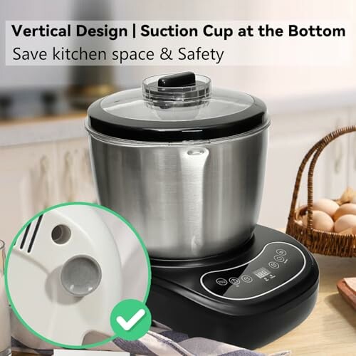 Vertical design mixer with suction cup base next to a bowl of eggs.
